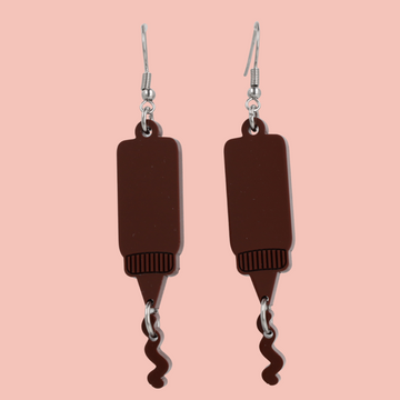 Stainless steel earwires featuring barbecue sauce acrylic charms with a charm joined to the bottle showing sauce coming out of it