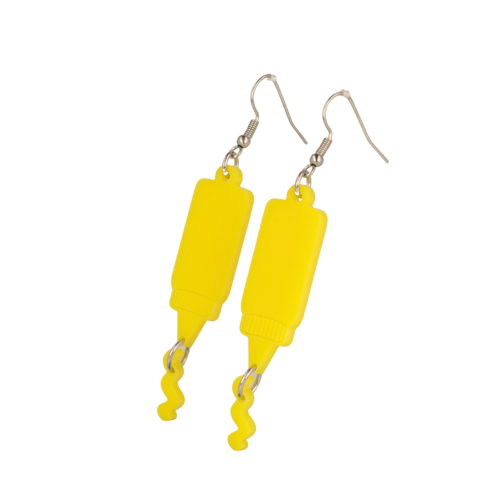 Stainless steel earwires featuring mustard acrylic charms with a charm joined to the bottle showing sauce coming out of it