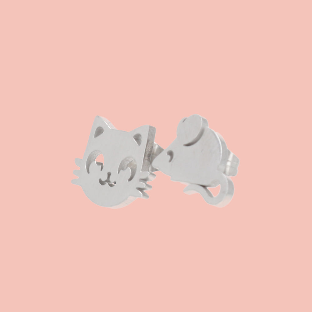 Stainless steel studs, one in the shape of a cat's face and one in the shape of a mouse