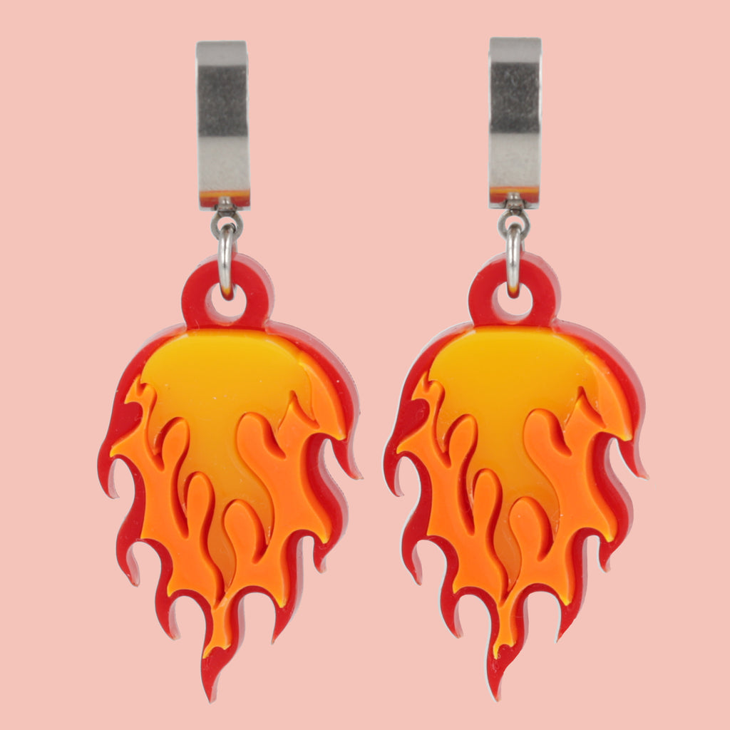 Flame charms on stainless steel huggie hoop earrings