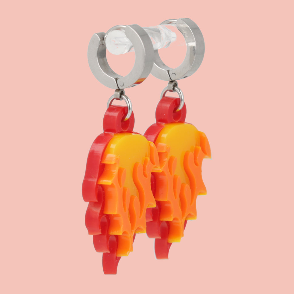 Flame charms on stainless steel huggie hoop earrings