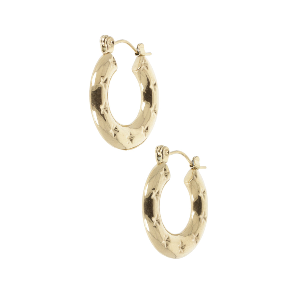 Gold horseshoe-shaped earring with stars surrounding the horsehoe