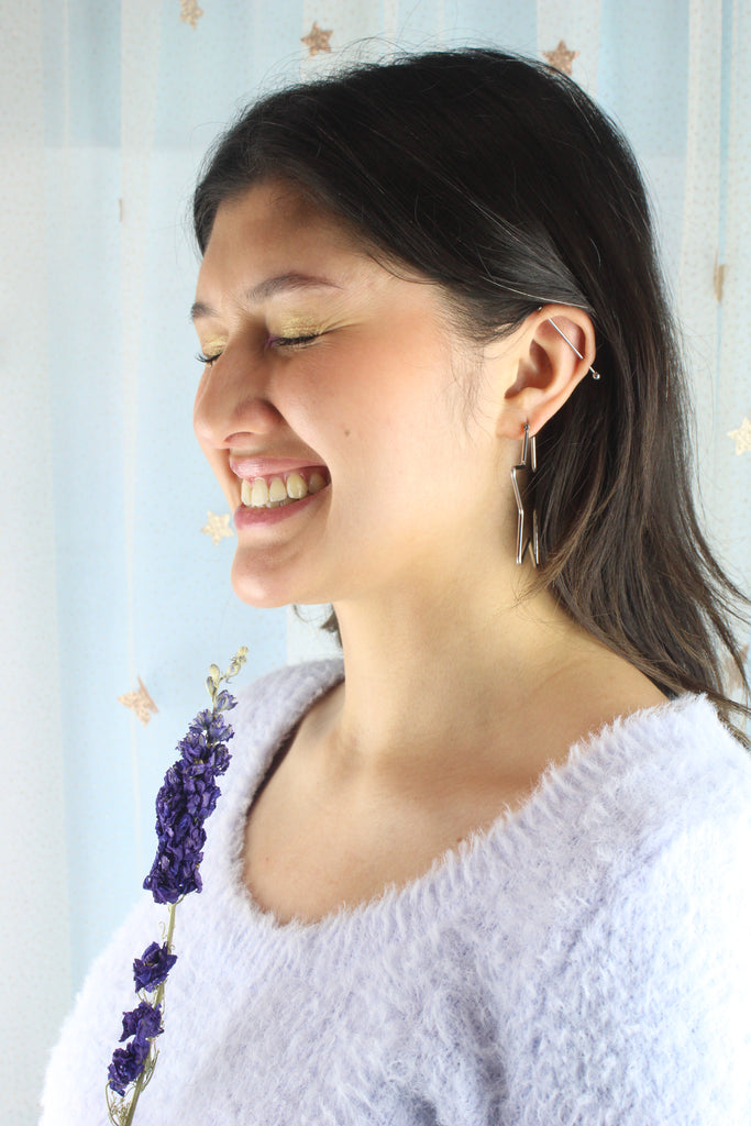 Model wearing Star shaped stainless steel hoops