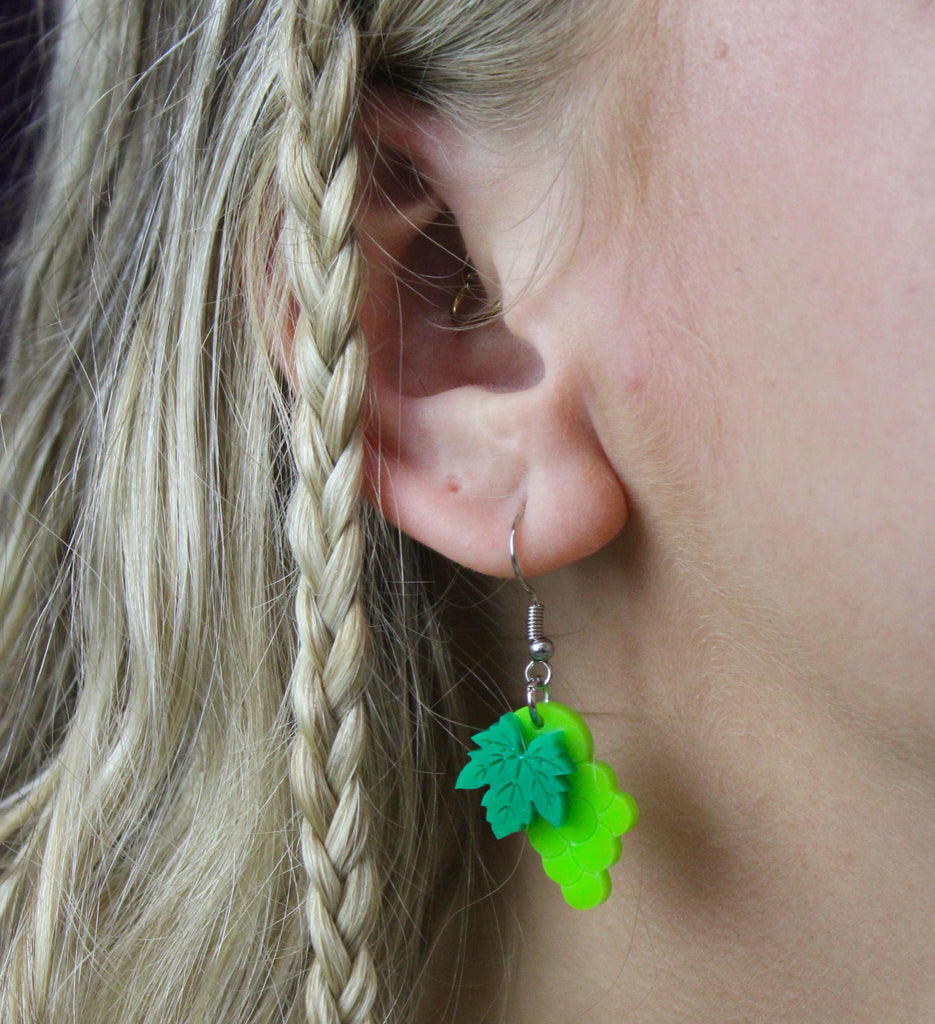 Model wearing  Acrylic green grapes charms on stainless steel earwires