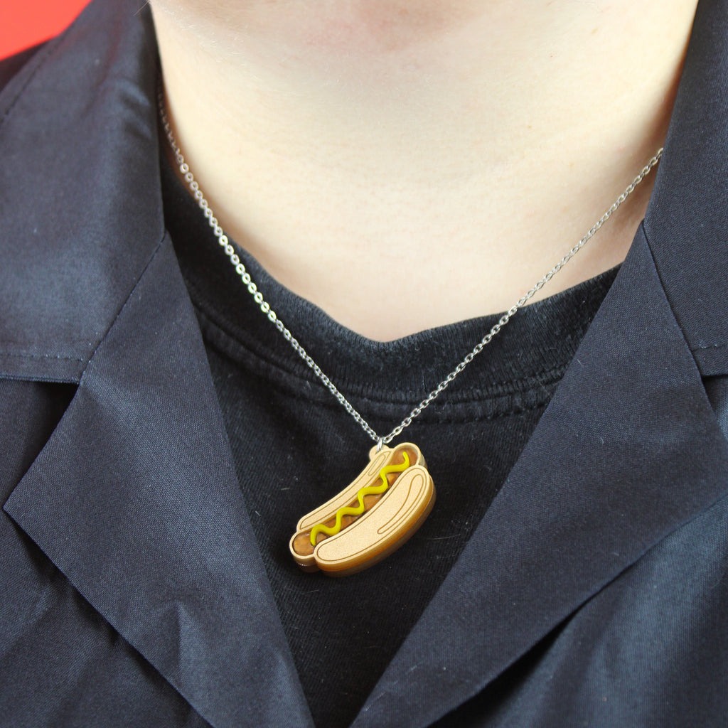 Model wearing Stainless steel chain with a mustard hot dog pendant