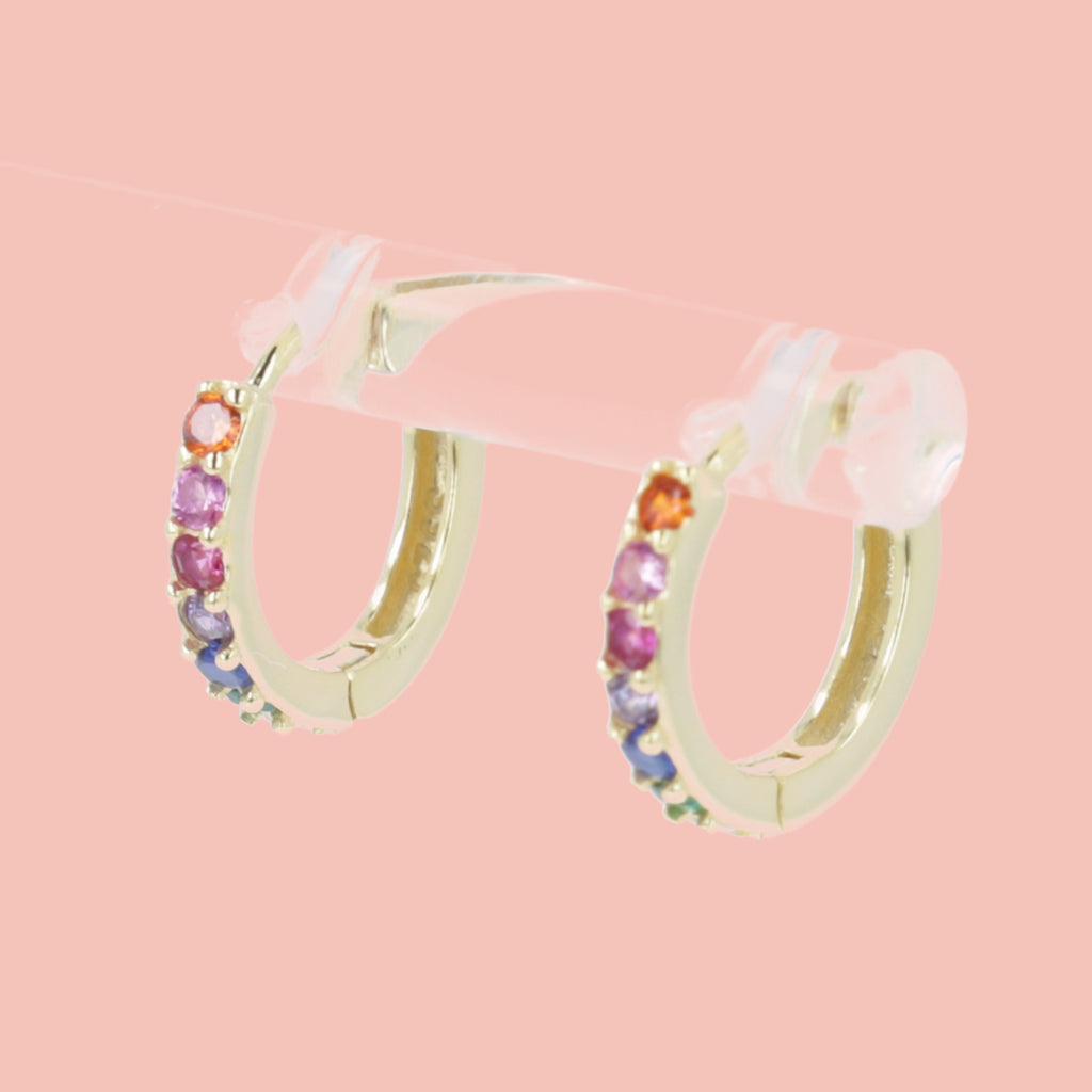 Orange, pink, purple, blue and green gemstones on a gold plated sterling silver hoop