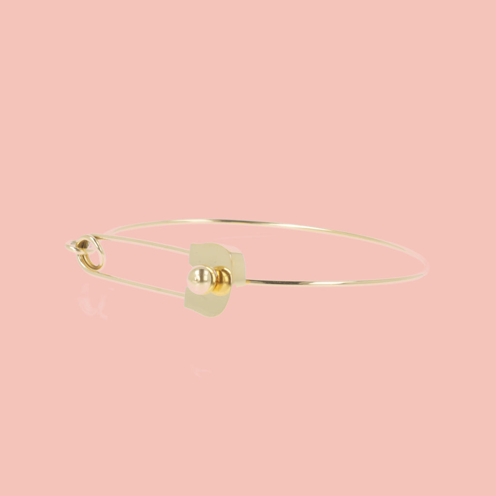 Gold plated stainless steel bangle witha safety pin fastening