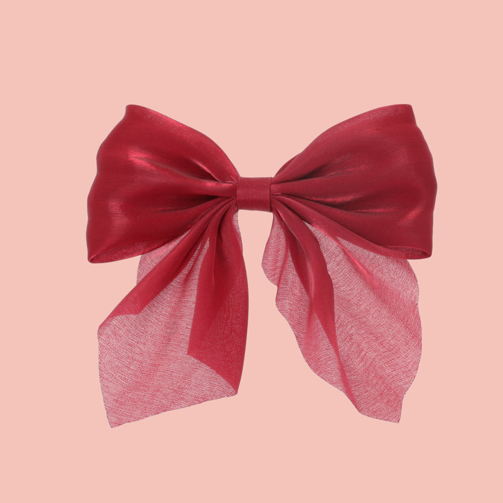 red shimmery hair bow with a base metal clip