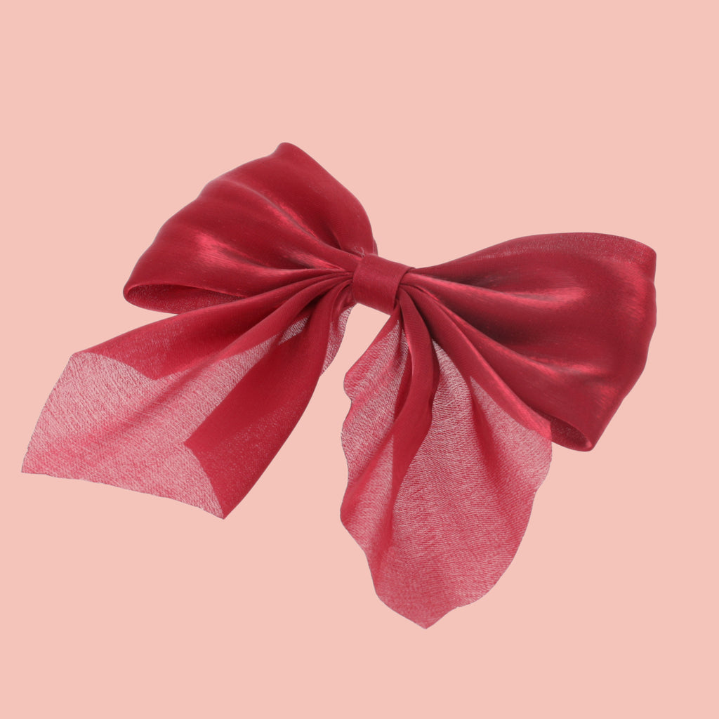 red shimmery hair bow with a base metal clip