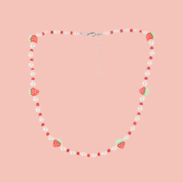 Faux pearl necklace featuring red beads and strawberry charms with a base metal clasp