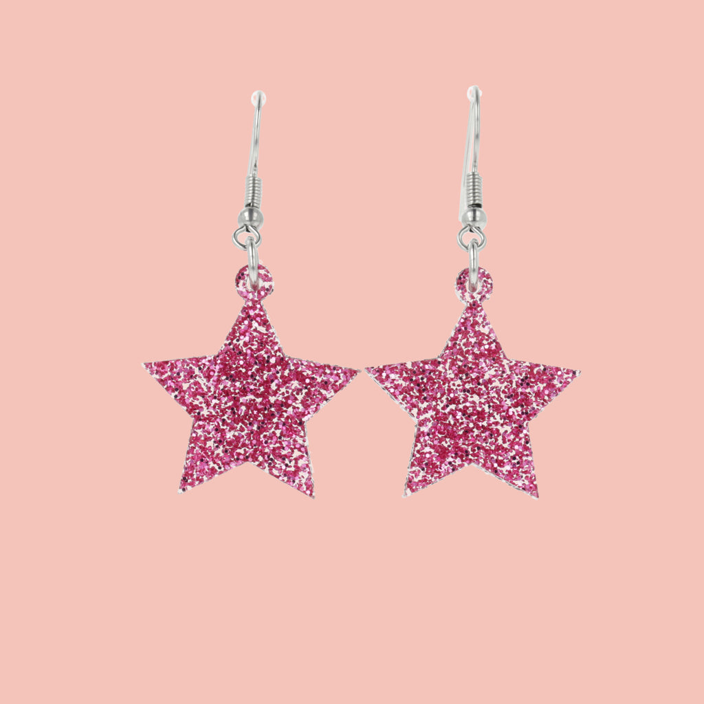 Pink glitter acrylic star charms on stainless steel earwires