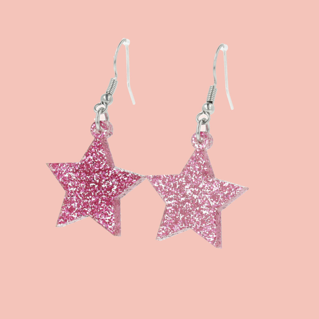 Pink glitter acrylic star charms on stainless steel earwires