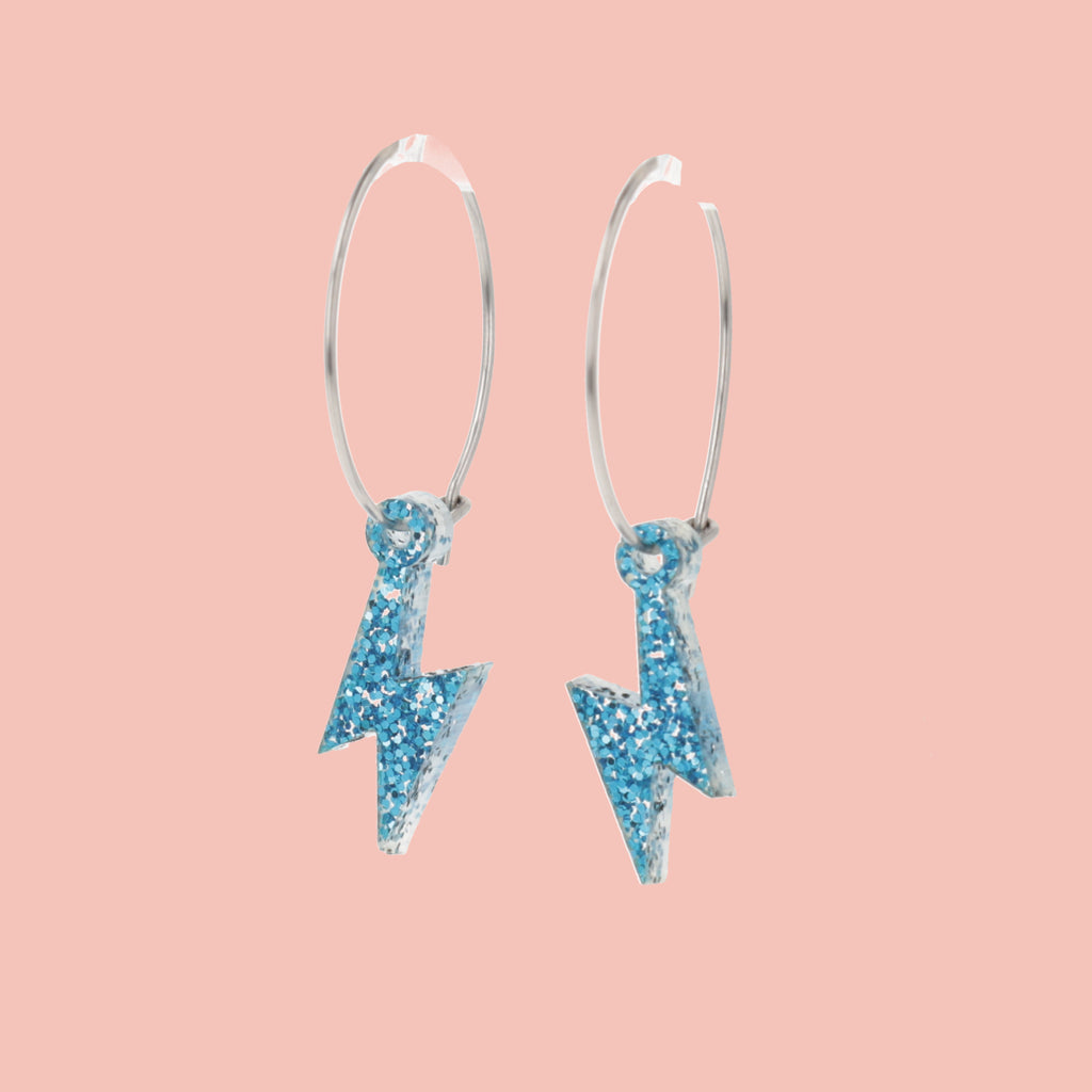 Mini Blue Glitter Lightning Bolt charms on stainless steel hoops