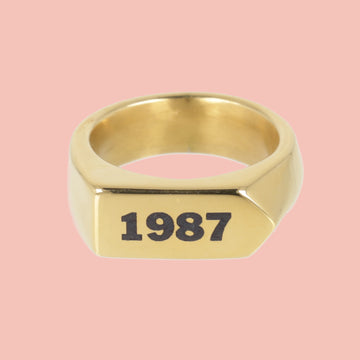 Chunky gold plated stainless steel ring with birth year engraved in black