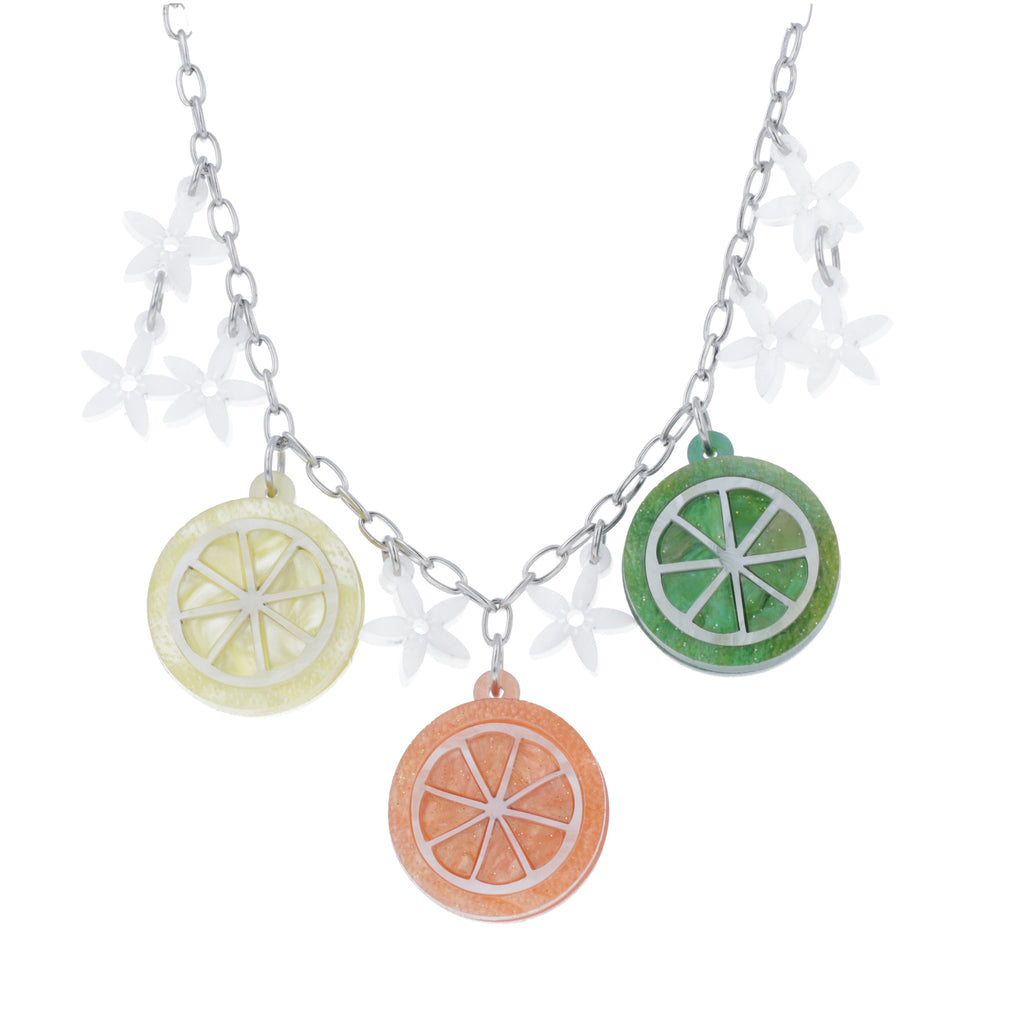 necklace featuring lemon, orange and lime slice pendants and white flowers on an oval link stainless steel chain