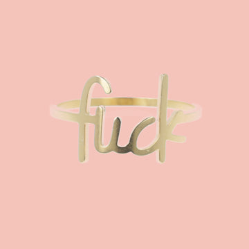 Gold plated titanium ring with the word f*ck printed on the front