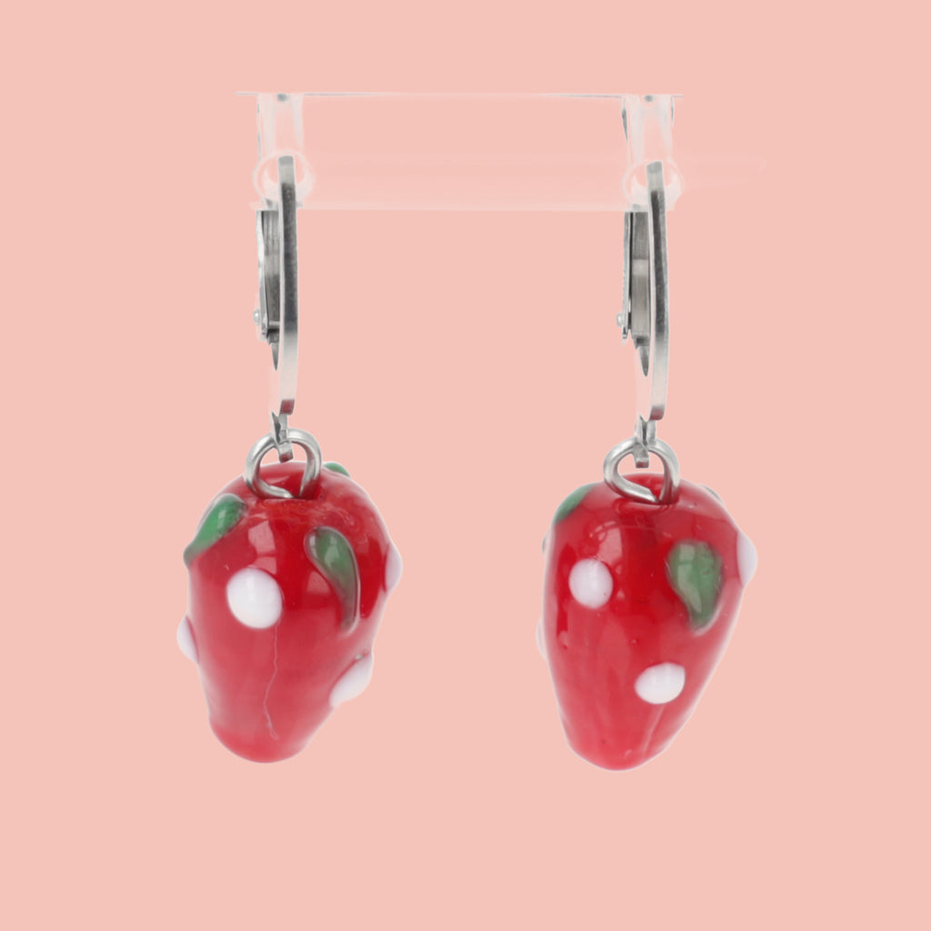 Glass strawberry charms on stainless steel huggie hoops