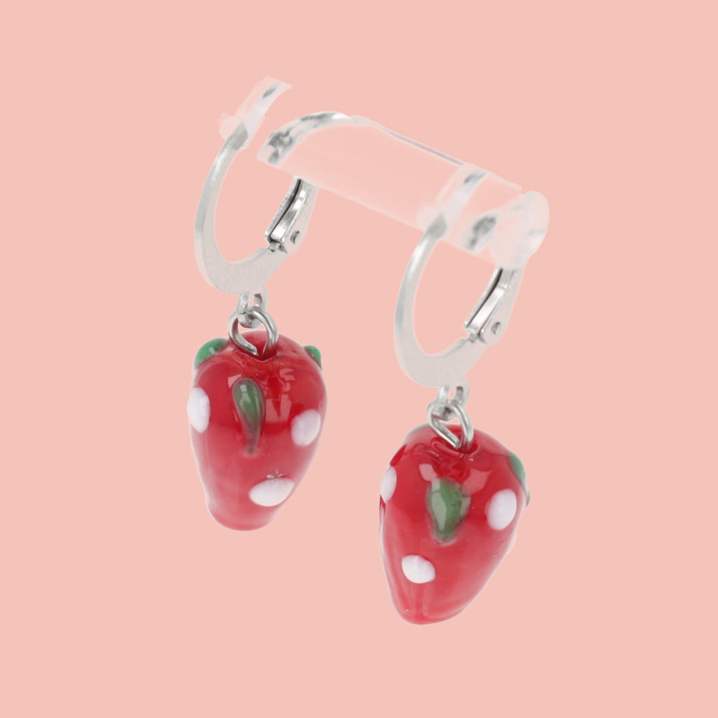 Glass strawberry charms on stainless steel huggie hoops