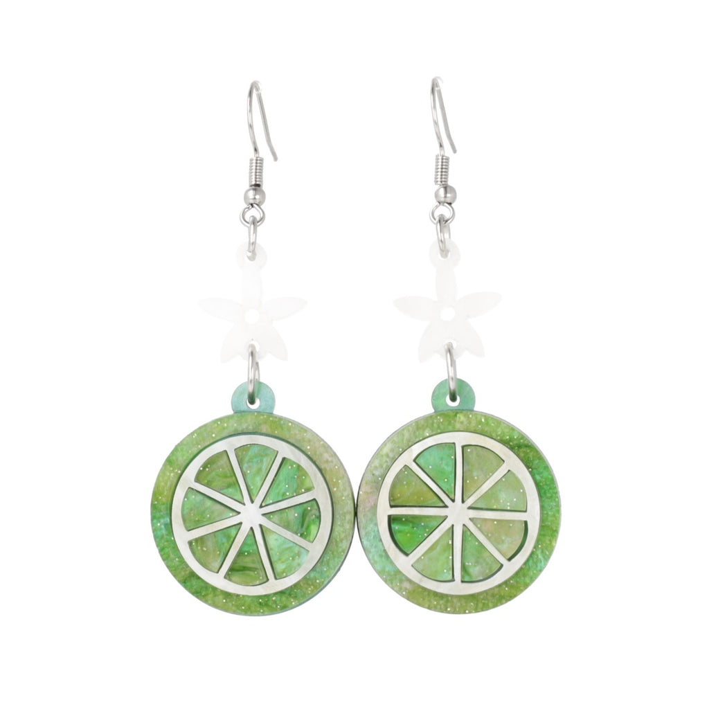 Glittery lime fruit slice charm suspended from a white flower on stainless steel earwires