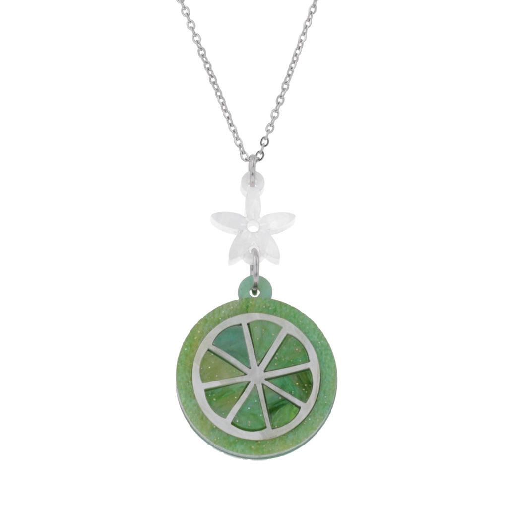 Lime slice pendant suspended rom a white flower and stainless steel chain