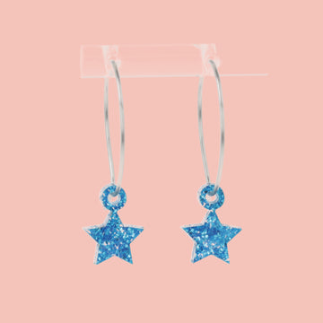 Mini blue glitter acrylic star charms on stainless steel hoops