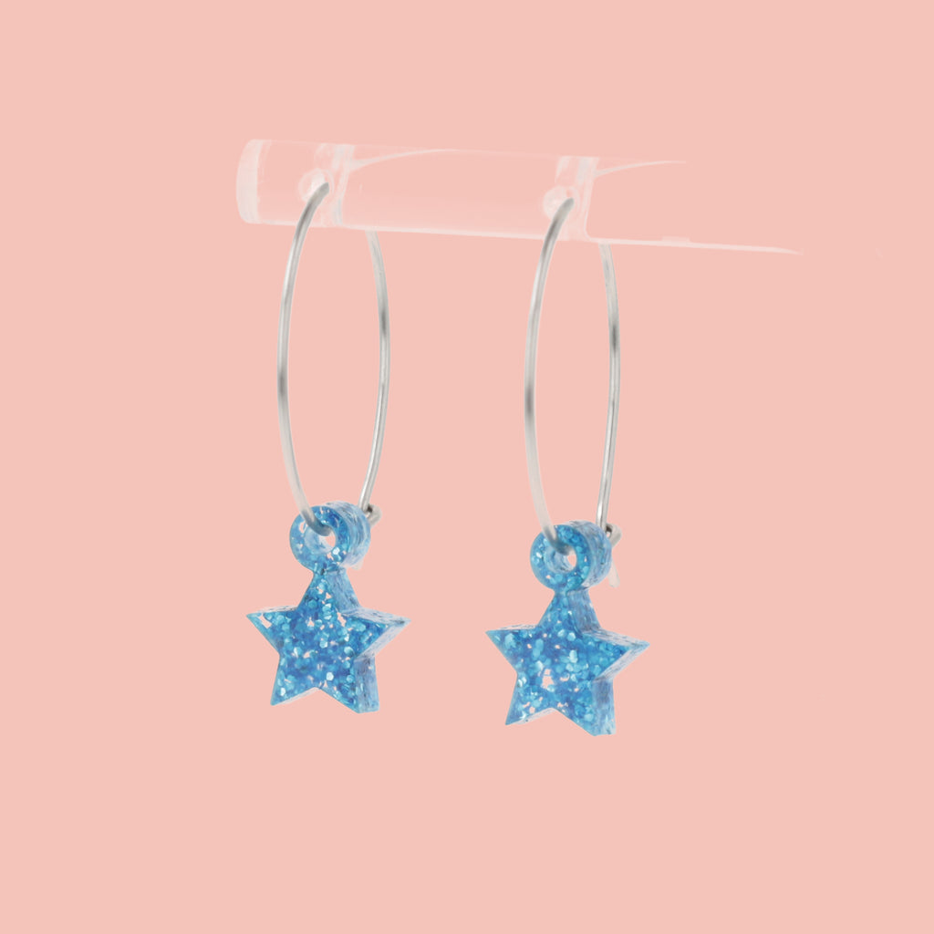 Mini blue glitter acrylic star charms on stainless steel hoops