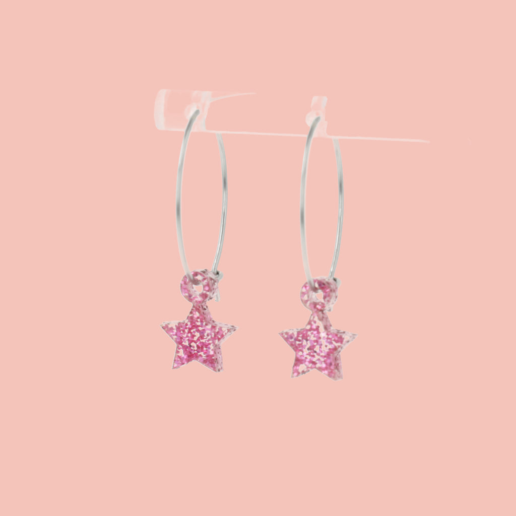 Mini pink glitter acrylic star charms on stainless steel hoops