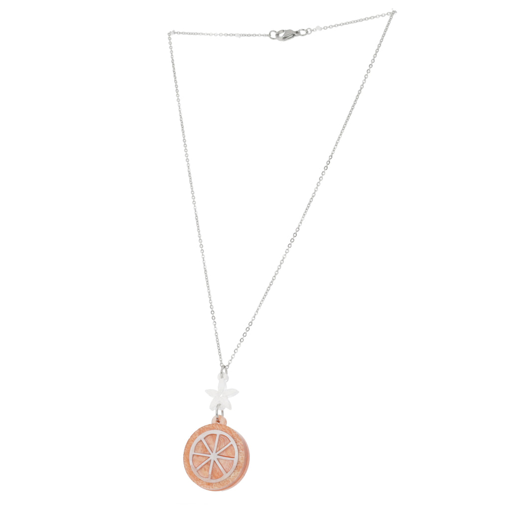 Orange slice pendant suspended from a white flower charm on a stainless steel chain