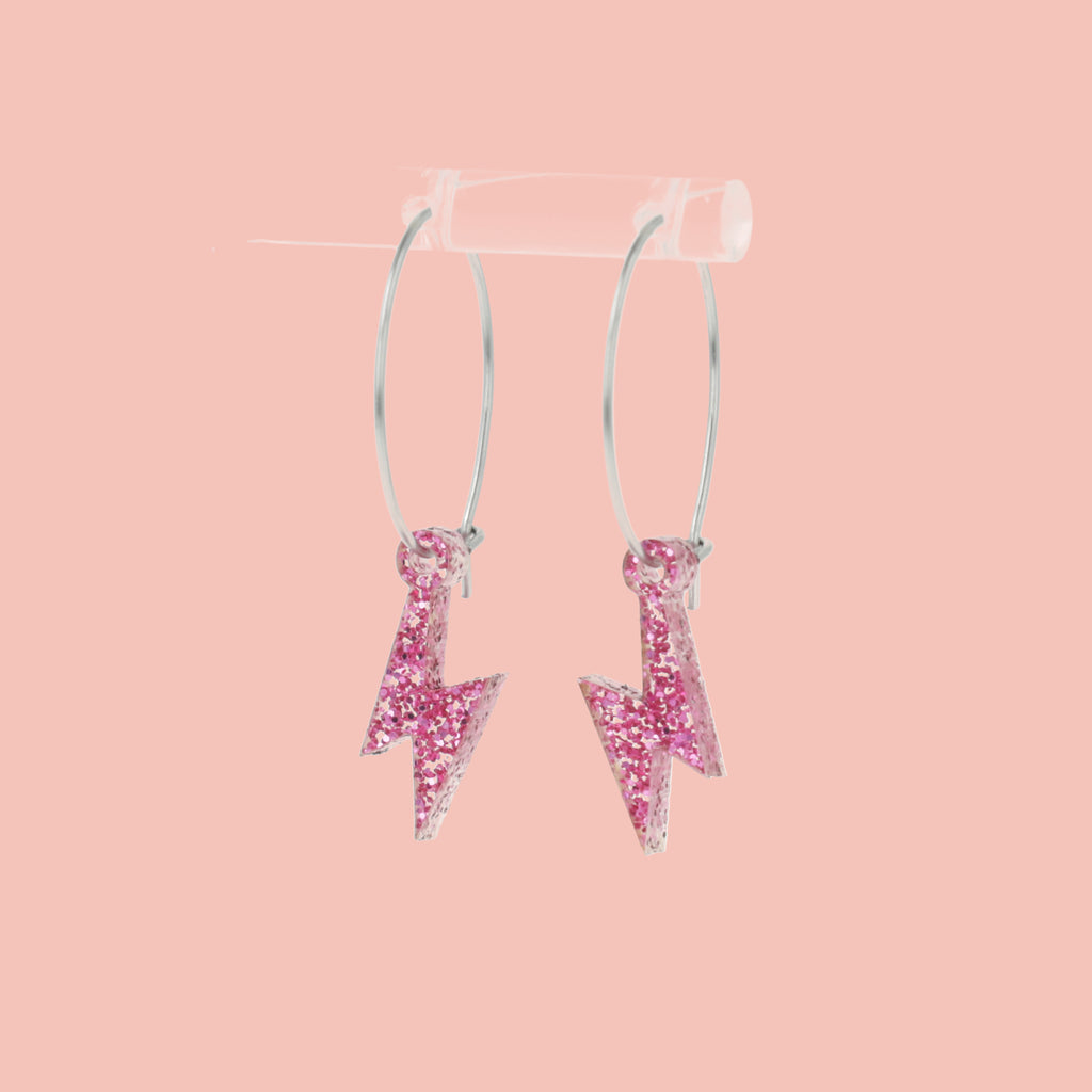 Mini Pink Glitter Lightning Bolt charms on stainless steel hoops