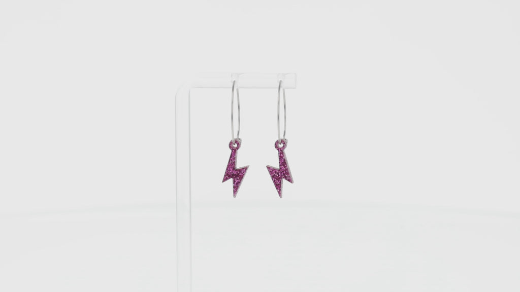 360 view of Mini Purple Glitter Lightning Bolt charms on stainless steel hoops