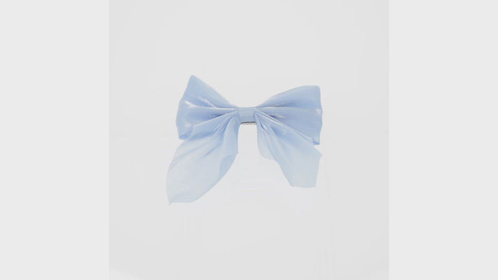 Shimmery blue bow with a base metal clip atta