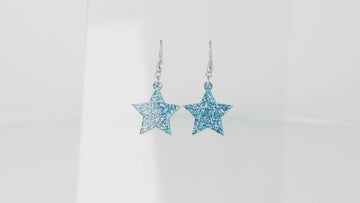 360 view of Blue glitter star charms on stainless steel earwires