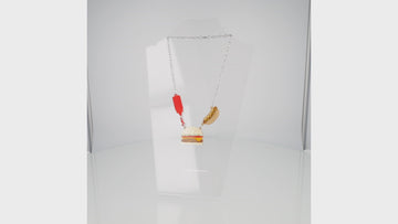 360 view of Stainless steel oval link chain with a kethup, cheeseburger and mustard hot dog pendant