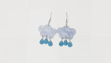 Baby blue marble clouds and blue glitter acrylic raindrop charms on stainless steel earwires