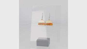 360 view of Cheeseburger acrylic charms featuring a beige bun and brown marble patty with lettuce and tomato with stainless steel earwires