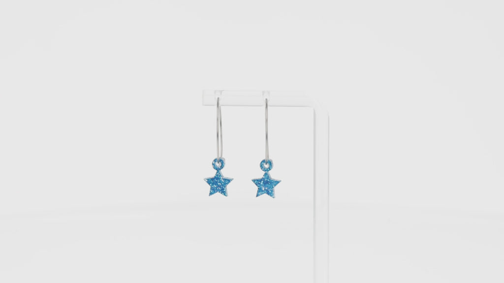 360 view of Mini blue glitter acrylic star charms on stainless steel hoops