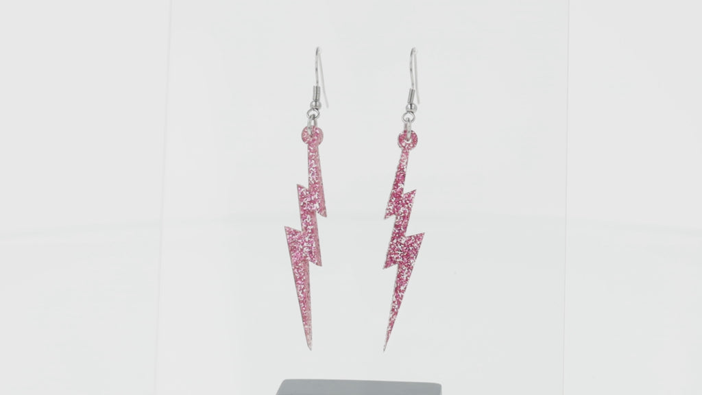 360 view of Pink glitter acrylic lightning bolt charms on stainless steel earwires