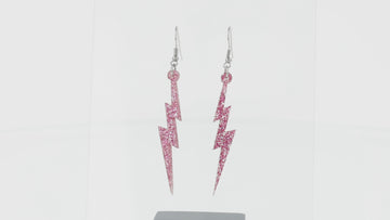 360 view of Pink glitter acrylic lightning bolt charms on stainless steel earwires