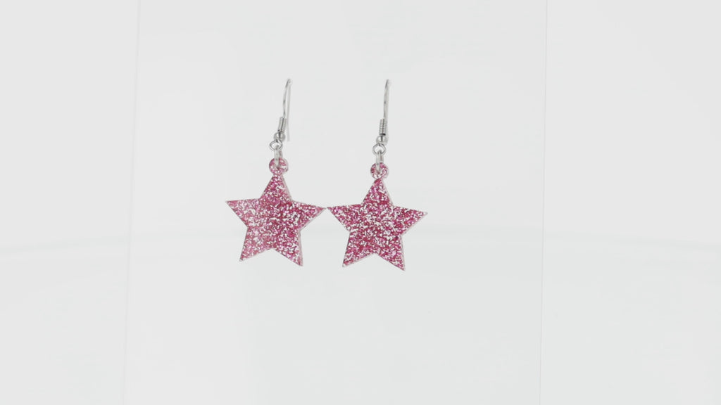 Pink glitter acrylic star charms on stainless steel earwires