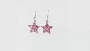 Pink glitter acrylic star charms on stainless steel earwires