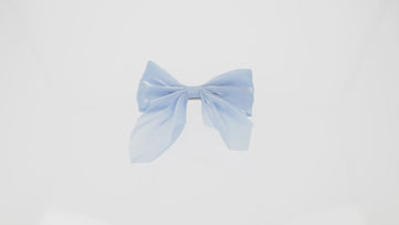 Shimmery blue bow with a base metal clip atta