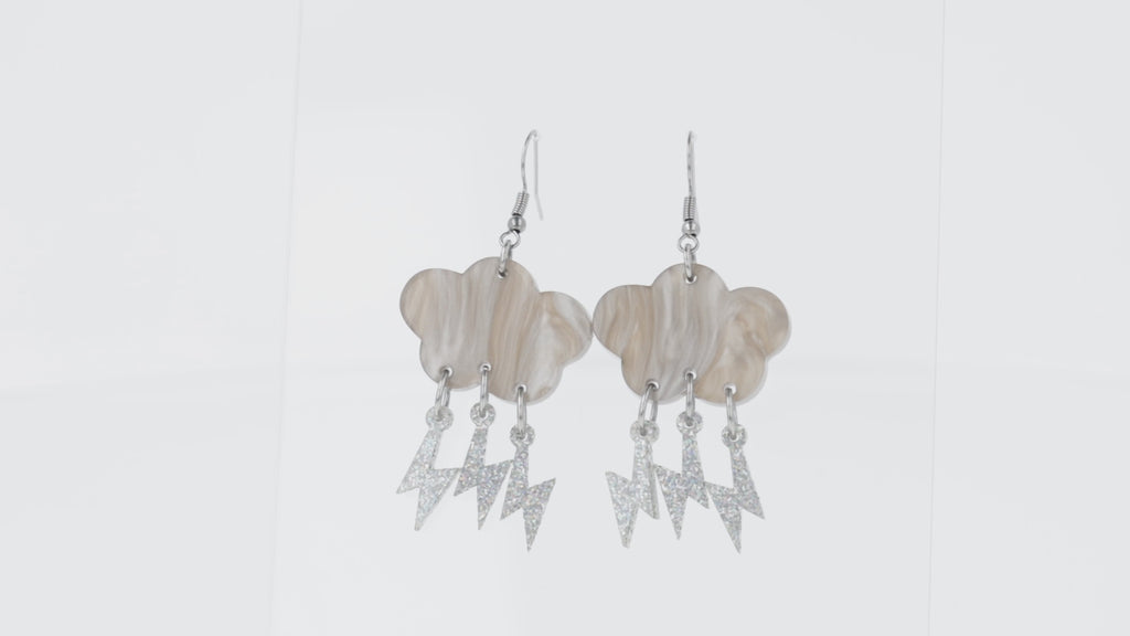 Grey marble clouds attached to silver glitter lightning bolt charms