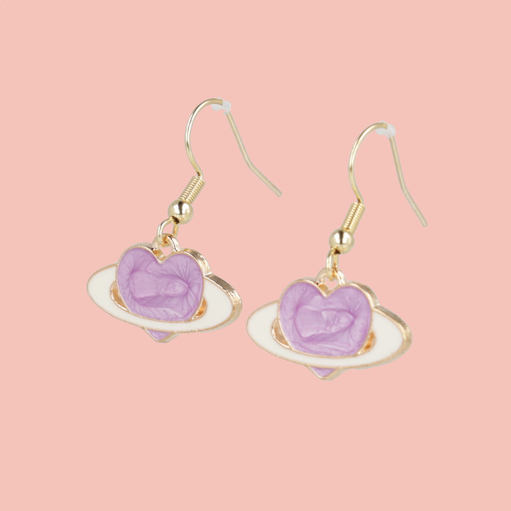 Lilac heart charms surrounded by a ring to replicate a planet, on gold plated stainless steel earwires