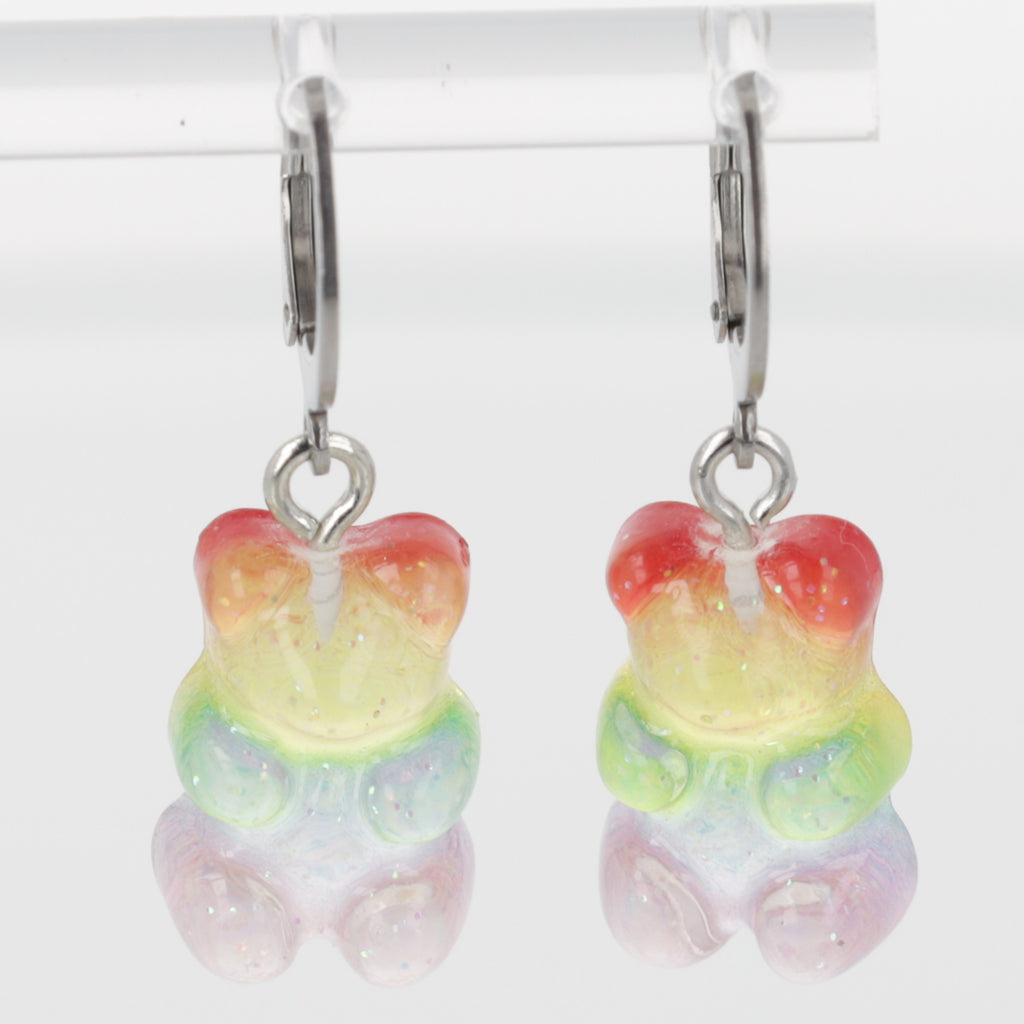 Sparkly rainbow gummy bear charms on stainless steel huggie hoops