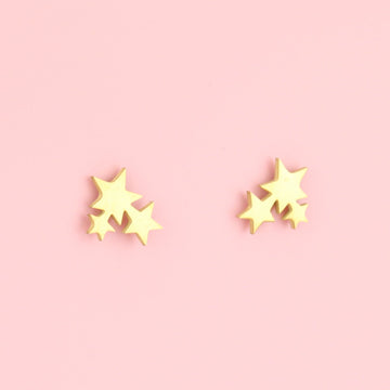 A cluster of three stars on gold plated stainless steel studs